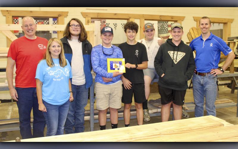 Fannin County High School wood shop students took first place in Freedom for Fido’s dog house contest in the amateur category. Shown are, from left, Freedom for Fido founders Fritz and Jackie Gilbert, students Jonah Couch, Silas Campbell, Griffin Disser, Ethan Conner, Connor Fisher and construction teacher Daniel Stewart.