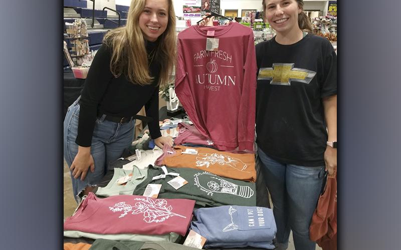 Vendor Kyndall Ledford, left, and Blue Ridge Elementary School teacher Hannah Nicholson take part in the Annual Harvest Sale the weekend of October 16 that was held at the Fannin County School System Ag Facility.