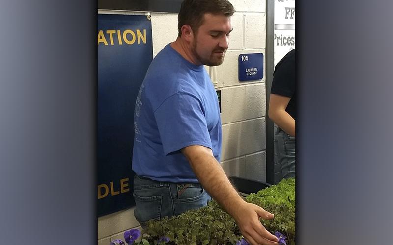 Seth Davis, Fannin County Middle School FFA advisor, helps educate patrons on these plants during the Annual Harvest Sale at the Fannin County School System Ag Facility the weekend of October 16.