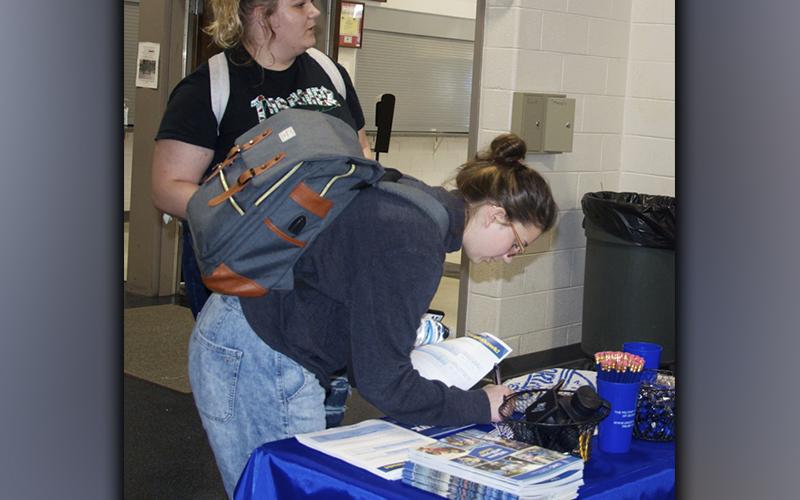 The Fannin County Development Authority organized a Job Fair at Fannin County High School in order to help students find part-time employment Tuesday, September 21. Kati Kraft signs her name down while Rylynn Boatright talks with a representative from the University of North Georgia.