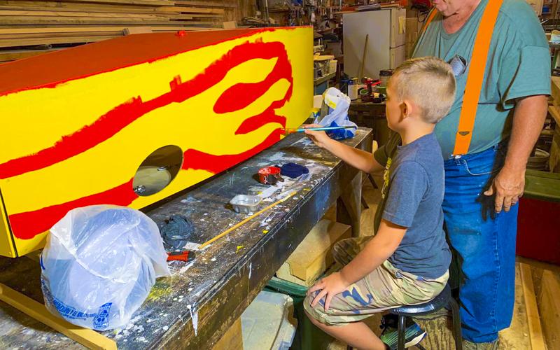 Seth Owenby and his grandpa, Steve Owenby work on their car for the Blue Ridge Soap Box Derby Fall Classic that took place Saturday, September 25.