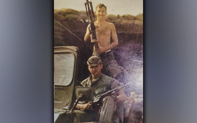 U.S. Army veteran Sonny Payne is shown shirtless while on tour in Vietnam. He said it was constantly hot and dry, which caused his hair to bleach out.