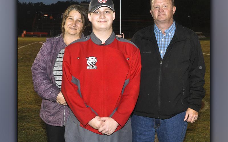 Copper Basin band senior Chase Green was recognized Friday, October 29, before the Cougars last home football game of the season. Green is shown with his parents Matt and Bobbie Green.