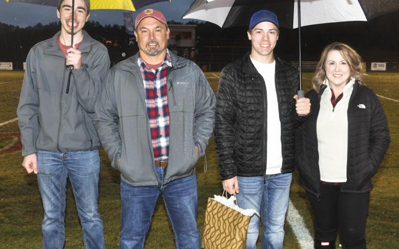 Copper Basin senior golfer Carson Fowler was recognized with the rest of the band, cheer, football and golf seniors during the Cougars final home football game of the season Friday, October 29. Shown during the ceremony are, from left, Cole Fowler, brother; Shad Fowler, father; senior Fowler and Becky Fowler, mother.