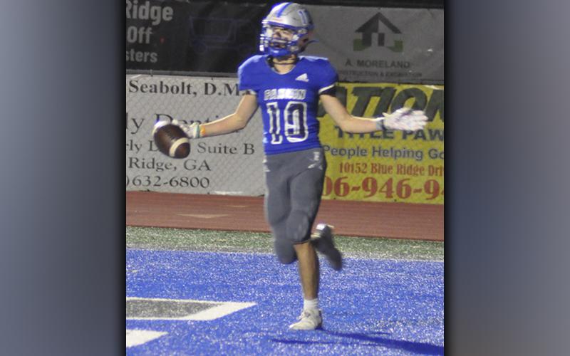 Carter Mann (10) celebrates after a nice touchdown grab during the Rebels playoff game against Fitzgerald Friday, November 19.