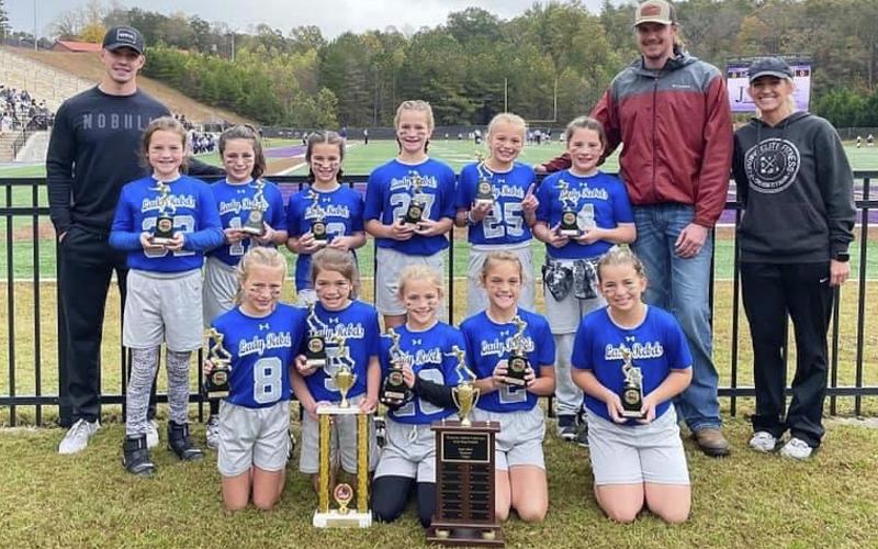 The Fannin County Lady Rebel flag football team won the first ever Super Bowl Saturday, October 30, against Lumpkin County. Shown following the win are, from left, front, McKinley Sandefur, Ryann King, Khloe Kay, Selah Patterson and Braylee Davenport; back, assistant coach Grant Fitts, Lynnex Patterson, Bristol Falls, Bailee Rhodes, Gracelyn Gray, Hadlee Patterson, Kayden-Leigh McClure, head coach Seth McClure and assistant coach Kristin Kay. Not pictured Violet Miller.