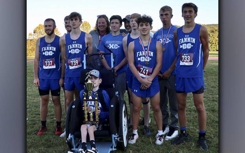 The Fannin County Rebels Cross Country team took home second place in their GHSA Region 7AA Championship Tuesday, October 26, at Pepperell High School. Shown following the meet are, from left, front, Brady Smith; and back, Samuel Jabaley, James Kyle, Phoenix Leifer, coach Suzianne Pass, Samuel McGill, coach Mike Cosentino, Luke Callihan, Zechariah Prater, Gavin Davis and Ben Bloch.