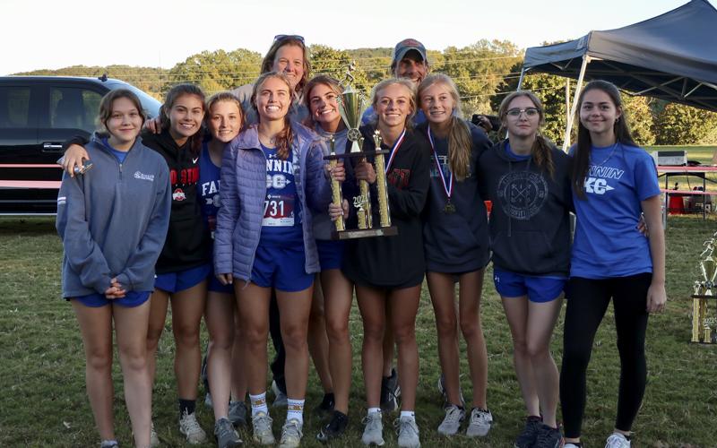 The Fannin County Lady Rebels Cross Country team took home first place in their GHSA Region 7AA Championship Tuesday, October 26, at Pepperell High School. Shown following the meet are, from left, front, Jaclyn Cracknell, Taylor Poland, Shaylee Jones, Kinsley Sullivan, Monica Cosentino, Carlee Holloway, Lindsey Holloway, MaKayla Jones and Kristen Cipich; and back, coaches Suzianne Pass and Mike Cosentino.