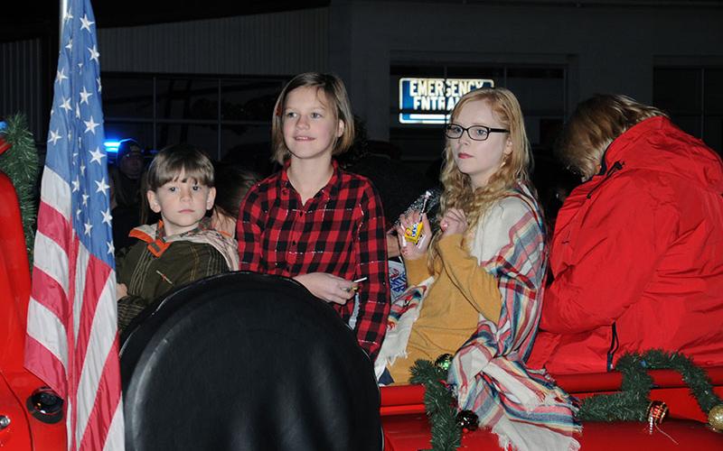 A group of paraders crowded into the bed of Doctor Bill Whaley’s vintage pick-up truck to spread Christmas cheer during the Blue Ridge Business Association’s Light Up Blue Ridge Parade Saturday night, November 27.