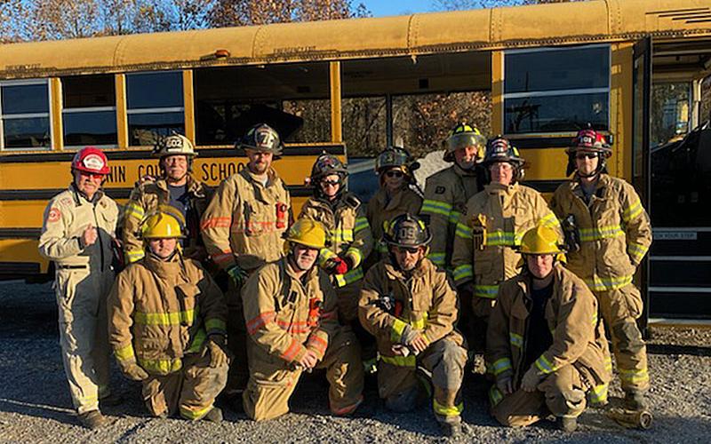 Among the group taking part in the school bus extrication class were, from left, standing, Starfire Training Systems Leigh Hollins , Deputy Fire Chief Rob Ross, Will Reed, Virginia Jones, Sharon Fox, Aaron Allen, Tanya Gregory, Michael Cornelius, and, front, Daniel Henderson, Jim Edelstein, John Calvert, and Michael Schuhle.