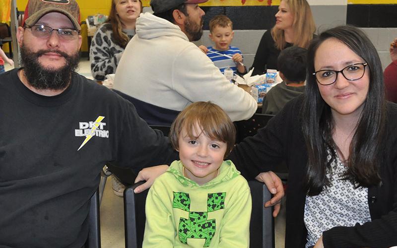 First grader Carter Pickard, middle, and his parents, Dillion and Stephanie Pickard, enjoyed having Thanksgiving lunch together at West Fannin Elementary School Thursday, November 18.