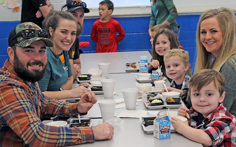 Enjoying a Thanksgiving meal are, from left, clockwise, John Adams, Morgan Thomas, Drew Thomas, Quincy Adams, Rile Thomas, Baylor Adams, and Brody Adams at East Fannin Elementary School Tuesday, November 16.