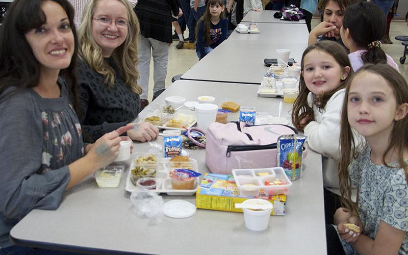 Blue Ridge Elementary School allowed parents and guardians to come enjoy a Thanksgiving lunch with their students Thursday, November 17. Eating are, from left, front, Angel Hughes and Elsie and, back, Jessica Thomas and Serah.