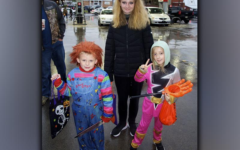 Case Harrison as Chucky, Winter Mcclananan as a pink Power Ranger and Toni Harrison as a black cat didn’t mind braving the rain and cool temperature in exchange for some candy during McCaysville and Copperhill’s Halloween Safe Zone Friday, October 29.