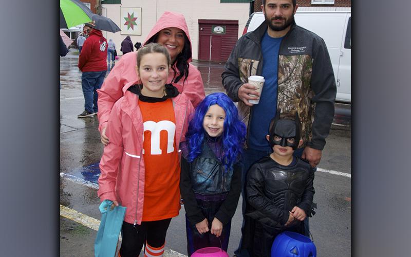 The rain and chill didn’t stop folks from getting out and trick or treating in McCaysville and Copperhill Friday, October 29. Among the ghosts and goblins are from left, front, McKinzee Easterling, Alivia Hyatt and Cutler Morris; back, Amber Henderson and Damon Morris.