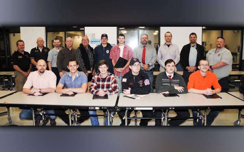 The Fannin County Fire Department recognized 13 new firefighters who successfully completed their National Professional Qualification (NPQ) 1 class. From left, seated, Will Reed, Jade Underwood, Kolton Stephens, John Sellers, Daniel Henderson, and Ryan Smith; and, standing, Fire Chief Larry Thomas, Assistant Fire Chief Rob Ross, Training Chief Michael Cornelius, James Edlestein, Mark Snoddy, Michael Schuhle, Gabriel Phillips, Chad Whitaker, Brett Crain, Steven Kirby, and South Battalion Chief Mathew Karry.