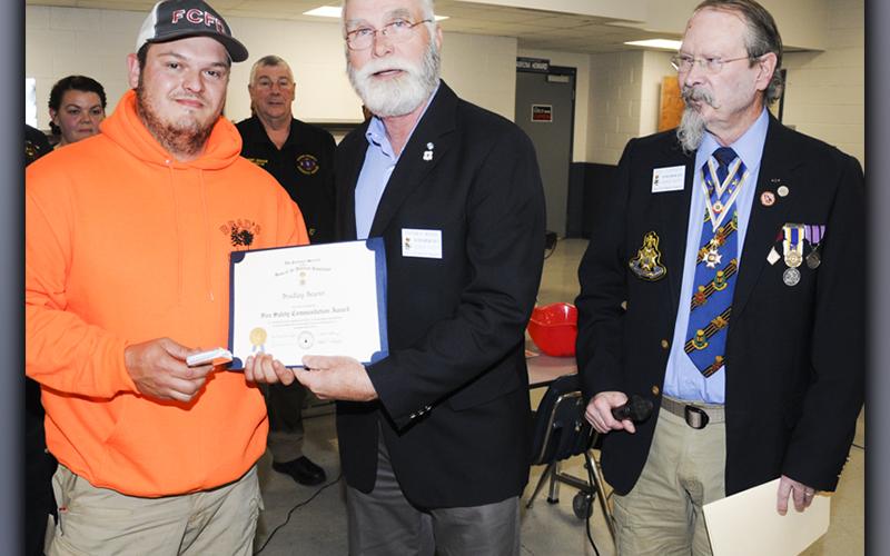 Representatives of the Blue Ridge Mountains Chapter, Sons of the American Revolution, presented Fannin County Firefighter Bradley Beaver with a Fire Safety Commendation award at the fire department’s annual Christmas banquet Thursday, December 9. Presenting the award were Stephen P. Weaver, center, and Sid Turner. The award honored Beaver, “in recognition of accomplishments or outstanding contributions to protect human life and property by preventing injuries or casualties due to fire.