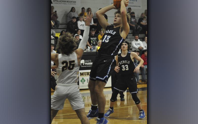Chasen Ethington shoots a fadeaway jumper Saturady, December 4, when the Fannin County High School Rebels basketball team took on the Murphy Bulldogs.
