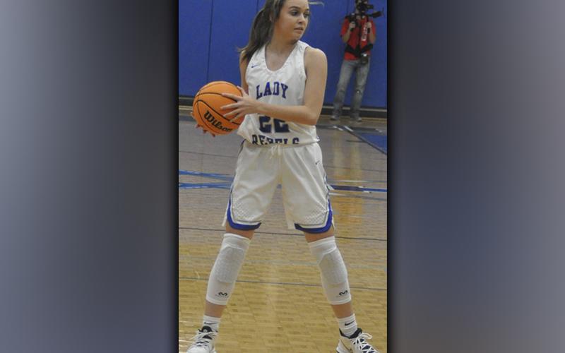 Lady Rebel Riley Reeves looks for the open cutter in recent action for the Fannin County Lady Rebels basketball team.
