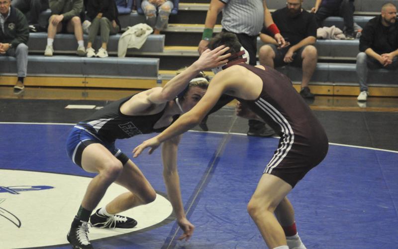 Blake Summers, left, works his opponent in recent action for the Fannin County Rebels wrestling team.