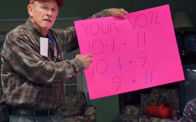 Lane Bishop explains to the Mountain Patriots how failing to vote actually reflects two votes.