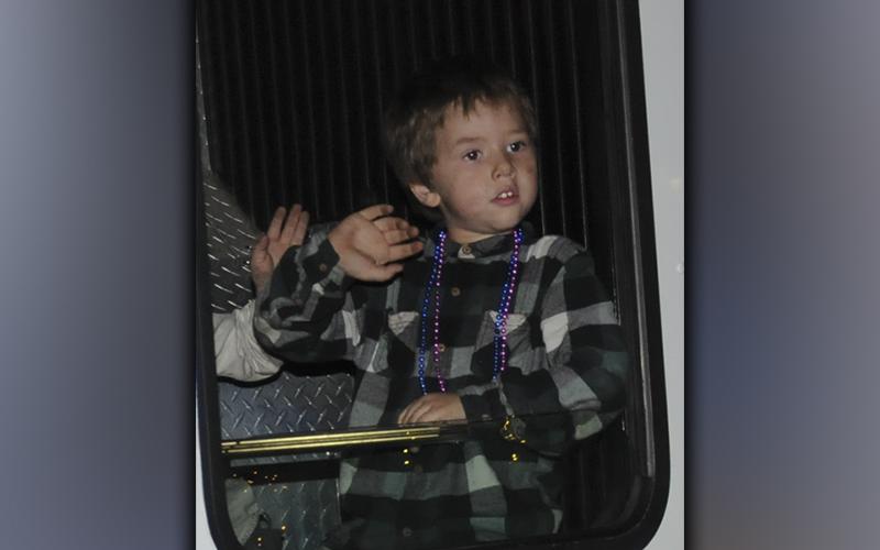 This young man was lucky enough to catch a ride on a fire truck in the Ducktown Christmas parade.