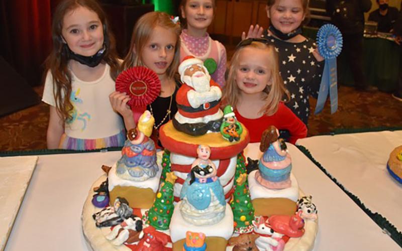 The Glitter Girls won second place in the Child Division (ages 5 to 7) at the National Gingerbread Competition, in Asheville, North Carolina, November 22. Shown with their creation are, from left, Violet Lakes, Sarah Miller, Maggie Schneider, Bryna Thompson and Caroline Montieth.
