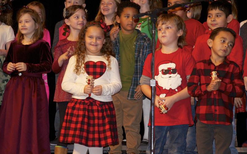 Performing a Christmas song are West Fannin Elementary School students, from left, front, Navaeh Grahl, Sawyer Graham, Julian Rosas and, back, Presley Mealer, Cassie Fowler, August Trammell and William Acevedo.