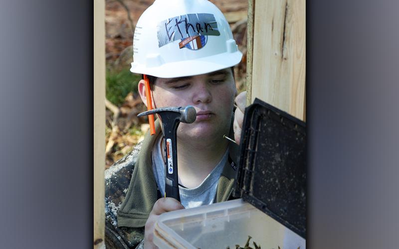 Fannin County High School Introduction to Construction student Ethan Conner lines up a nail as he helps complete the latest Habitat for Humanity of Fannin &amp; Gilmer Counties build. Anyone interested in joining habitat’s efforts may contact habitat Executive Director Christopher Hall at 706-455-6603.