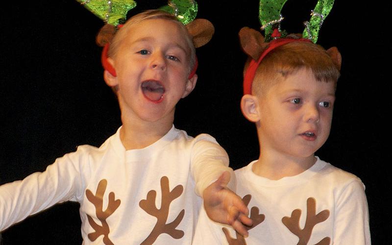 East Fannin Elementary School pre-k students Henry Kinser and Haegen Collis rock the stage during the school’s “A Season of Joy” performances at the high school Performing Arts Center Friday, December 17.