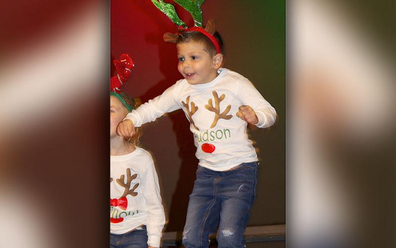 East Fannin Elementary School pre-k student Hudson Wright jumps in the air while performing the “Reindeer Hokey Pokey” during the schools Christmas performances Friday, December 17.