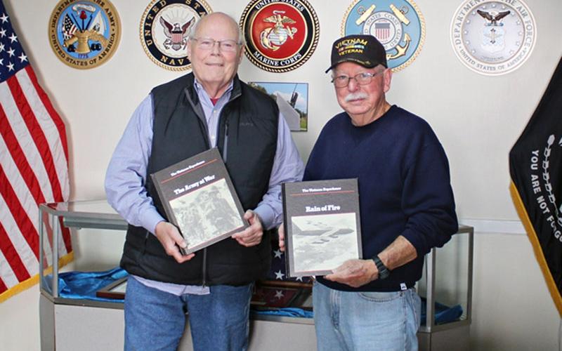 Vietnam veteran John Parrot, left, recently donated 53 books to the Fannin County Veterans Museum. He is shown beside fellow Vietnam veteran Rod McIntyre, representing the museum.