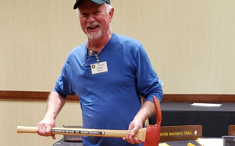 Gilbert Treadwell holds up his 2021 Benton MacKaye Trail Association Trail Worker of the Year axe that was presented to him at the association’s Annual Meeting Awards Ceremony Monday, November 13.