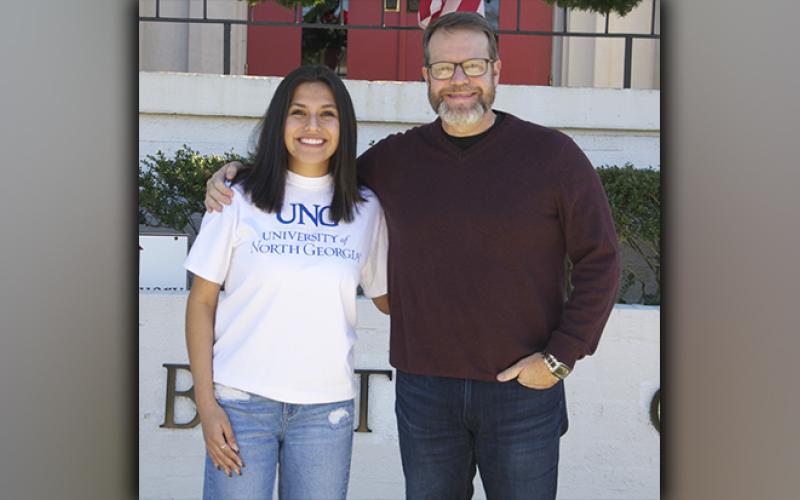 Lesley Salas is shown with Pastor Bob Richardson outside First Baptist Church of Blue Ridge.