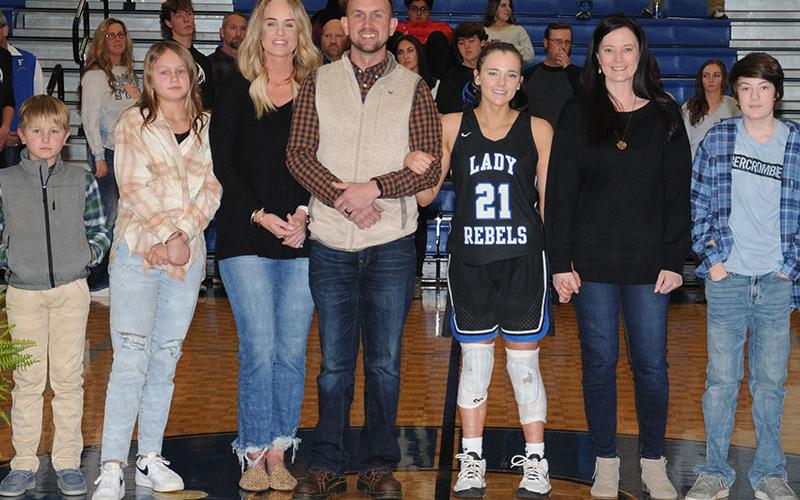Jenna Young was one of three seniors on the Lady Rebels basketball team honored at Fannin County High School Friday night. A four-year varsity player, she is shown with her family including, from left, brother and sister Mason and Taylyn, step-mother and father Michelle and Jeff Young, mother Rachel Adams, and brother Brody.