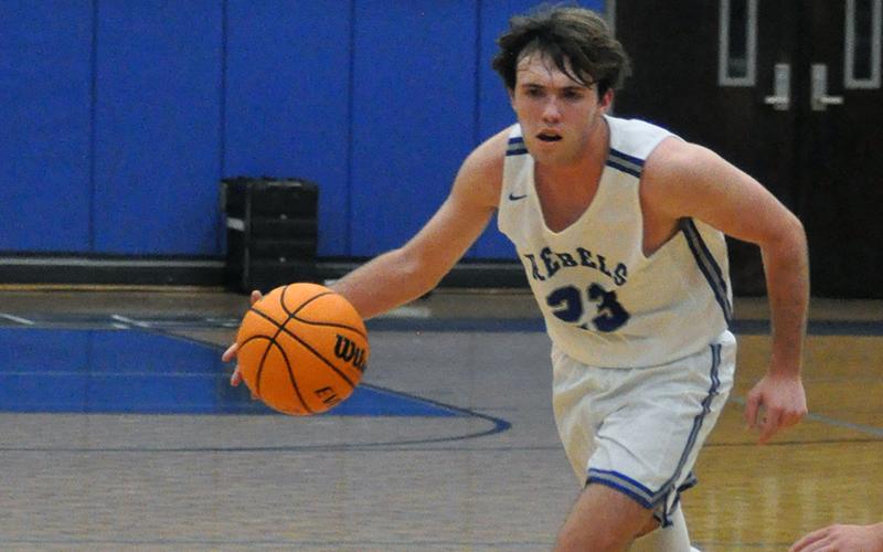 Fannin County Rebel Jordan Bennett drives past a defender in recent action for the Rebels basketball team.