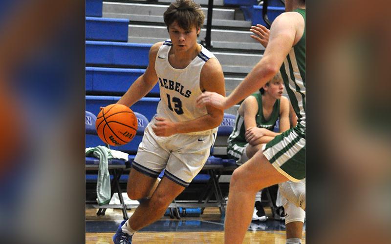 News Observer photo/Caleb Collins Chasen Ethington gets past a defender on the way to a two-point basket in recent action for the Fannin County Rebels basketball team. Ethington had 19 points in the Rebels match up against the Johns Creek Gladiators Wednesday, December 29.