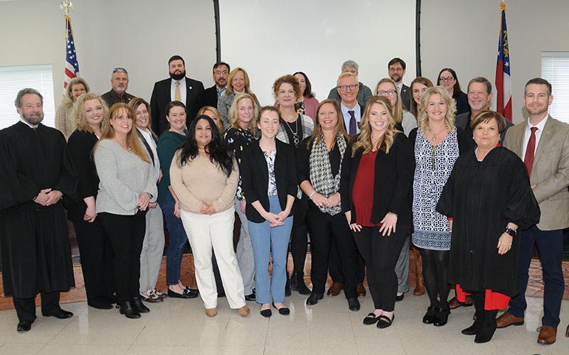 A large group of family, friends, co-workers, and district attorney (DA) staff members were present when Frank Wood was sworn in as the new chief assistant district attorney for the Appalachian Judicial Circuit Friday, January 14, at the Fannin County Courthouse in Blue Ridge. Wood is shown near the center of the group above that included District Attorney B. Alison Sosebee, members of DA’s staff from all three offices, Chief Superior Court Judge Brenda Weaver (front right) and Superior Court John Worcester