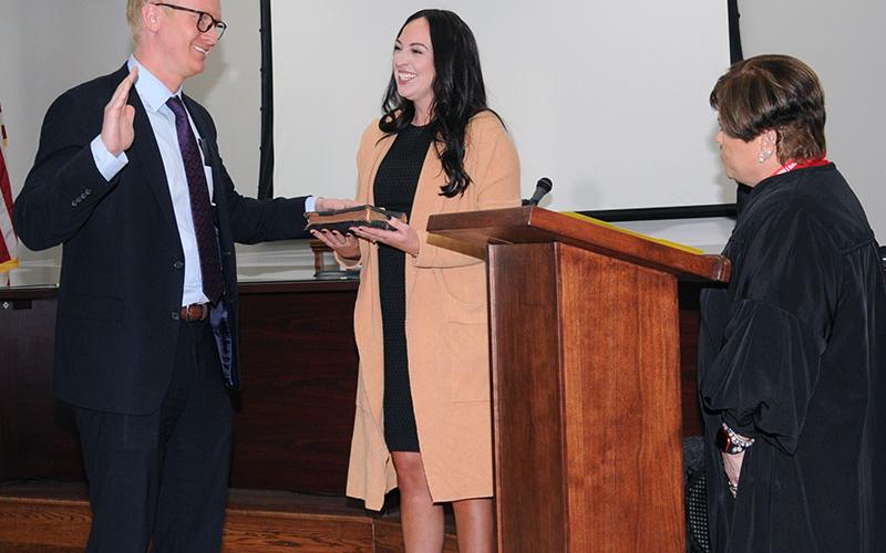 Frank Wood is shown taking his oath of office as the new chief assistant district attorney for the Appalachian Judicial Circuit from Chief Superior Court Judge Brenda Weaver. Holding the Bible for Wood is his fiancee, Kali Henderson. Wood was named to his new position by District Attorney B. Alison Sosebee.