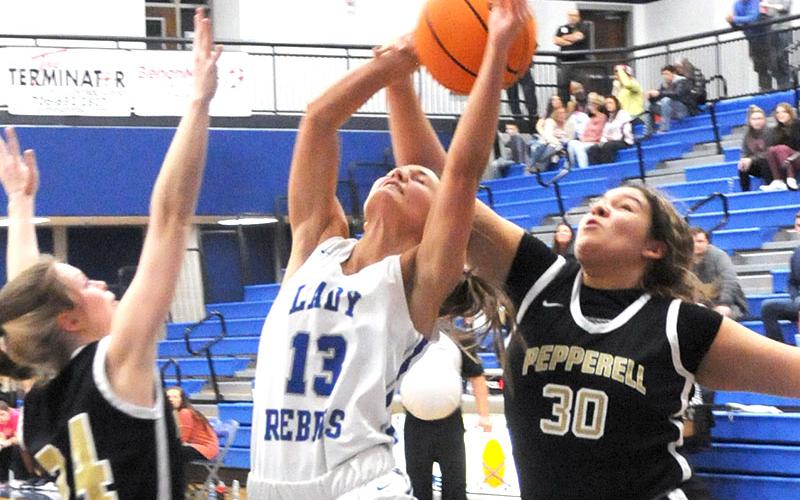 Fannin County’s Becca Ledford is fouled as she goes up for a layup against Pepperell Wednesday, January 19, at Fannin High.