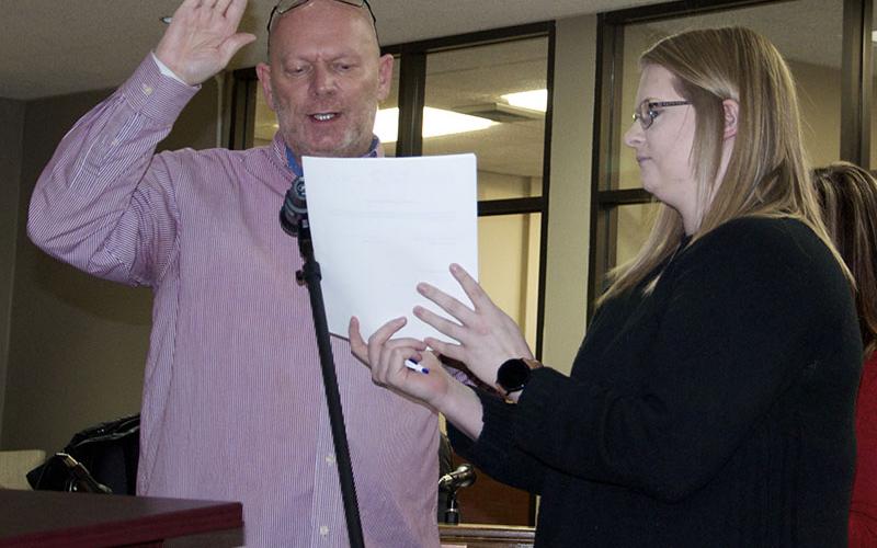 Blue Ridge Councilman Bill Bivins is shown giving his Oath of Office during the new administration’s first council meeting Tuesday, January 18. Beside Bivins is City Clerk Amy Mintz.