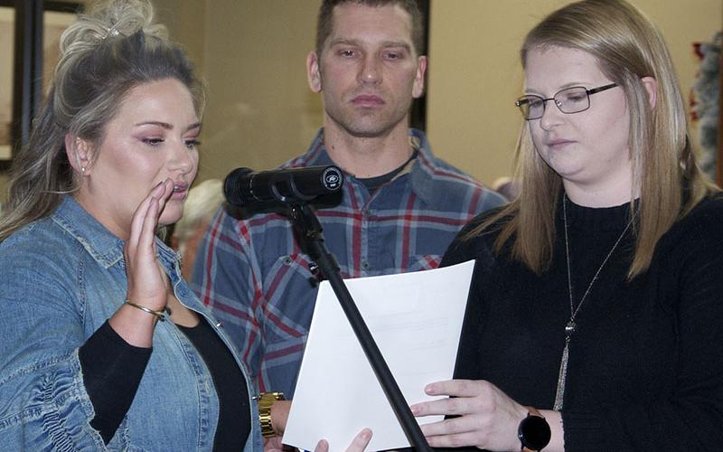 Giving her Oath of Office is Blue Ridge Councilwoman Christy Kay, left, with brother, Thomas, holding the bible and City Clerk Amy Mintz.