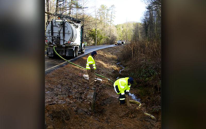 Marion Environmental Inc. was on site and fracking hazardous waste out of the drainage ditch just south of the entrance leading to the Toccoa River Swinging Bridge Wednesday, January 12, after a truck hauling concrete additive wrecked the previous day.