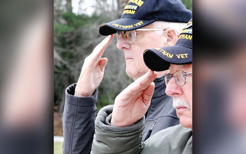 U.S. Army veteran Jerry Williams is shown saluting the American Flag during a Pearl Harbor Day ceremony in 2018.