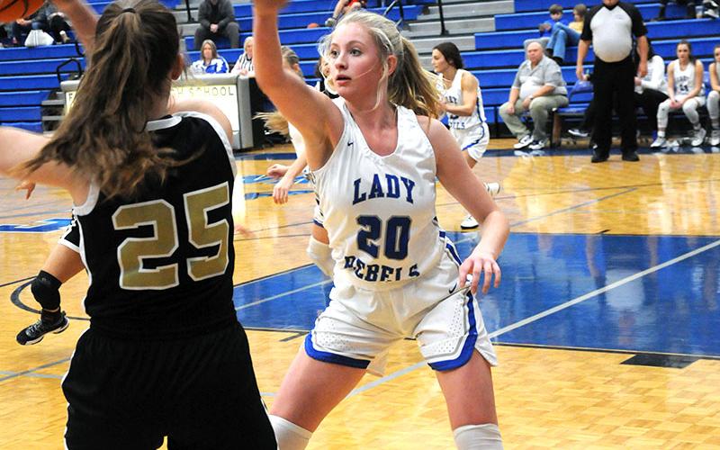 The Lady Rebels’ Ava Queen works against Pepperell’s Emma Kate Owen.