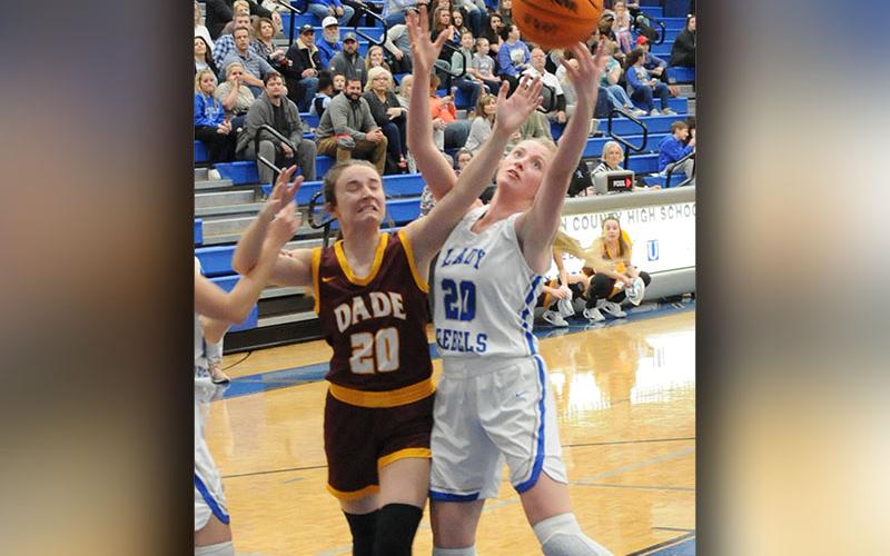 Lady Rebel Ava Queen fights for a rebound in last week’s Fannin County action.