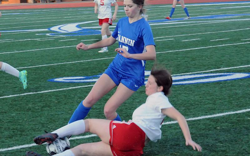Fannin County’s Cali Tuggle battles for the ball in soccer action at Fannin County High School earlier this season. The Lady Rebels are 5-0 and 2-0 in the region going into Friday’s match against region foe Pepperell at home. The girls’ match begins at 5 p.m. and the boys’ will get underway at 7 p.m.