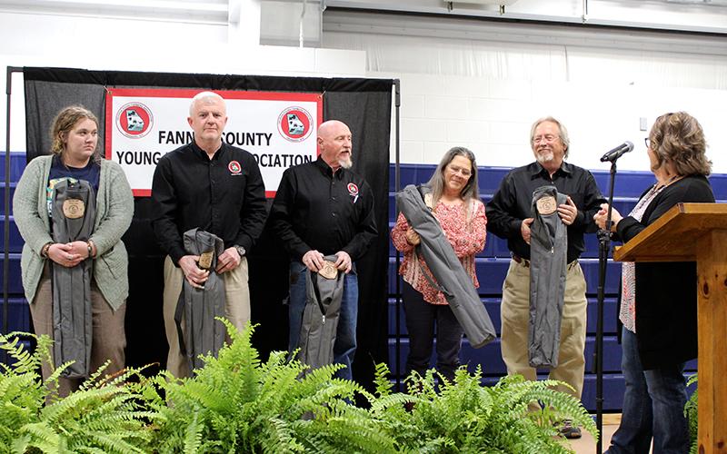 The 2021 Fannin County Young Farmers Association (FCYFA) officers were presented with a gift of appreciation at the FCYFA Awards Banquet February 4. Shown are, from left, Tayelor Long accepting for her mother, Secretary Terrie Long, Vice President Darrel Davis, President Kenny Queen, Dee Henderson accepting for Director of Public Relations Margery Dallas, Mike Henderson accepting for Treasurer Kenny Holland and Advisor Rhonda Mathews who presented the gifts.