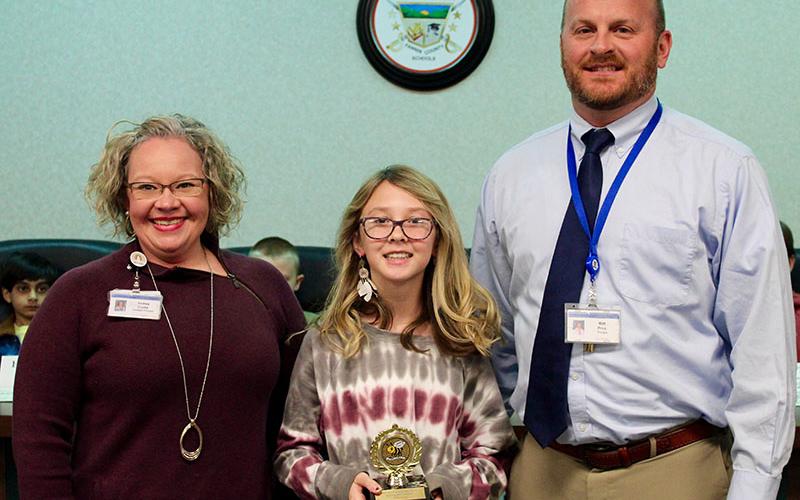 East Fannin Elementary School (EFES) fifth-grader Danica Nicholson, middle, was this year’s Fannin County School System’s Spelling Bee runner-up. Shown with her is, EFES Assistant Principal Andrea Crump and EFES Principal Mathew Price.