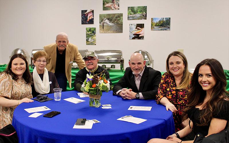 A chilly evening did not stop attendees from enjoying the Blue Ridge Mountain Trout Unlimited’s (BRMTU) Back the Brookies Winter Bash held Saturday, January 29. Shown are, from left, Emily Owenby, Janice Waldrop, BRMTU member and event coordinator Bob Borgwart, Danny Waldrop, Anthony Lowman, Emily Frazier and Cassie Spurling.